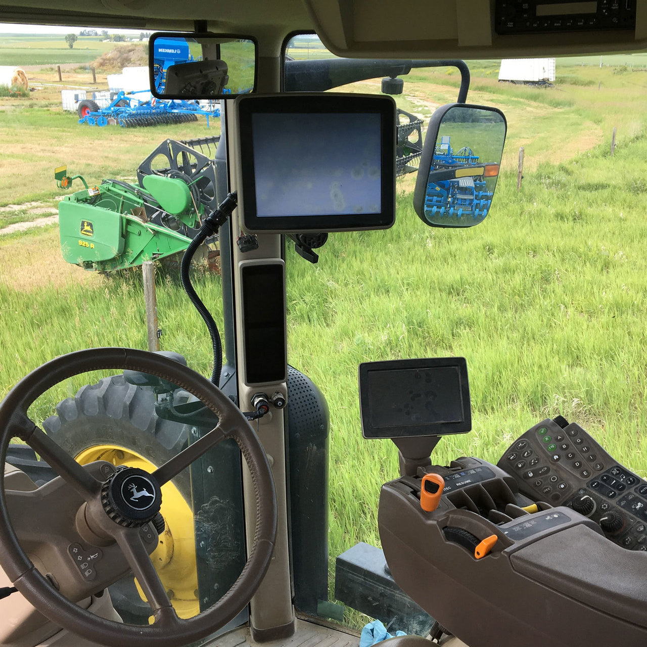 High Mounted Display in a John Deere R-Series Tractor using the 3-foot Wire Harness Extension.