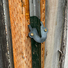 Bracket to attach steel t-post to wooden fence
