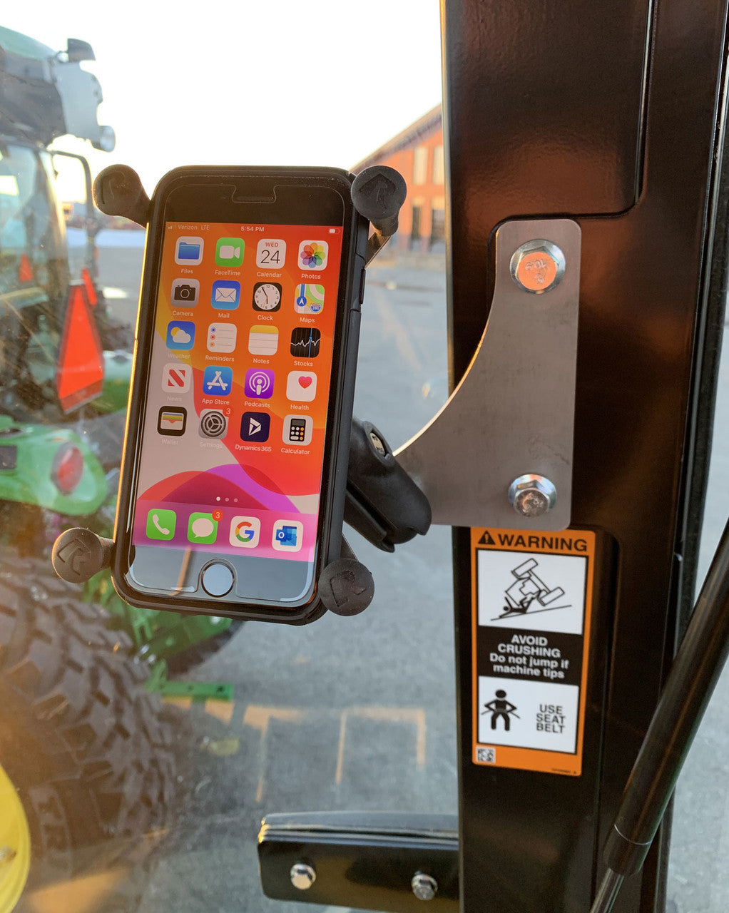Phone holder kit for a John Deere 3R and 4R compact tractor cab